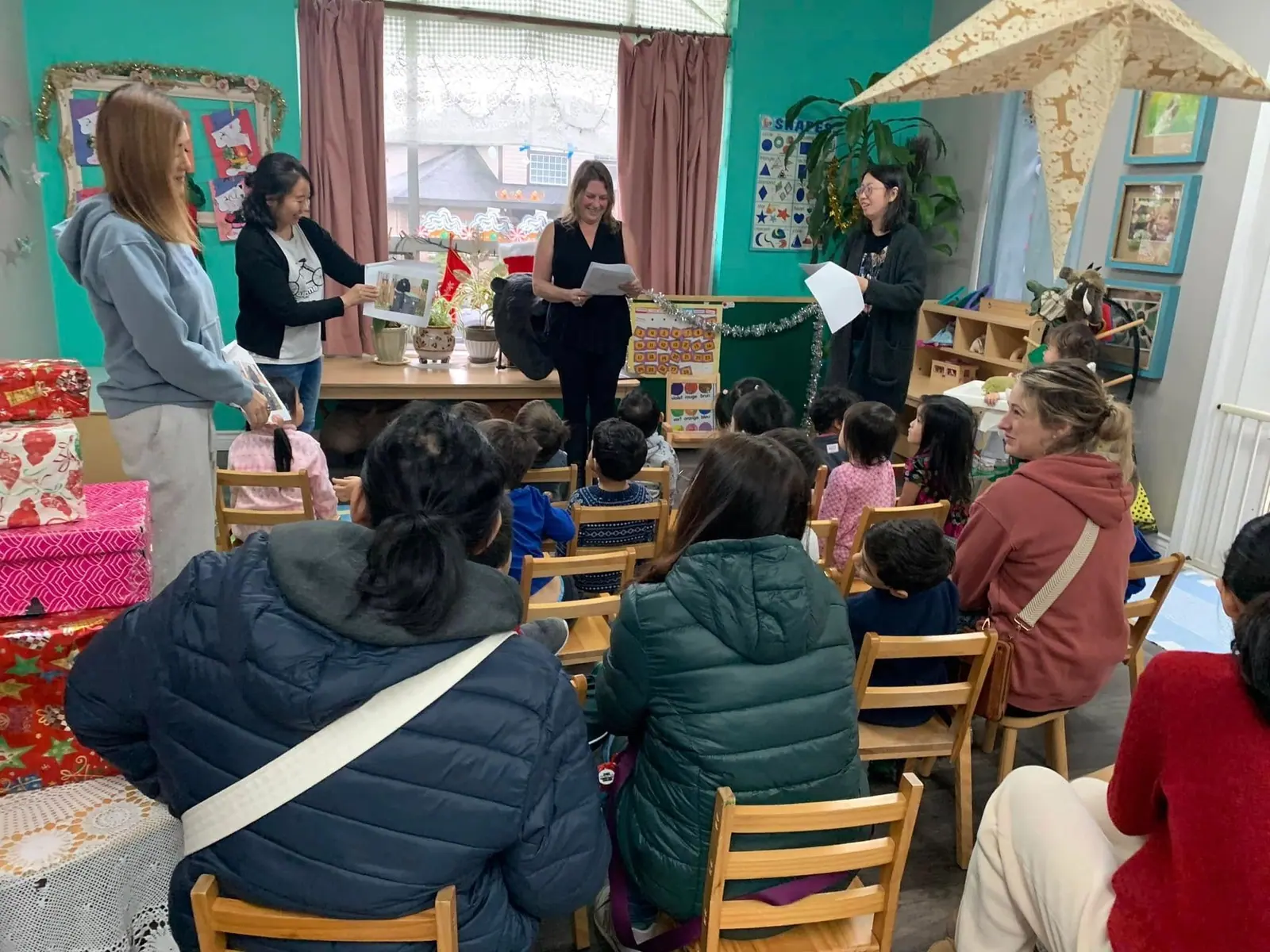 Parents and children gathered together in the classroom for a family evening