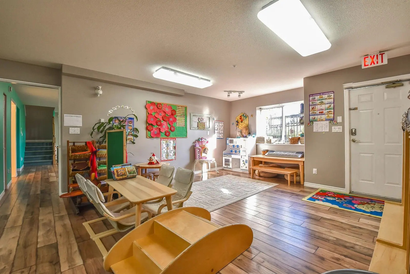 A quiet room with a sofa and a rocking chair, used for stories and rest